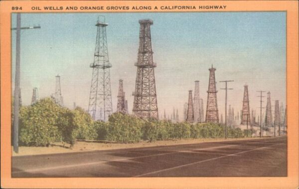 Los Angeles California Oil wells and orange groves along a cal