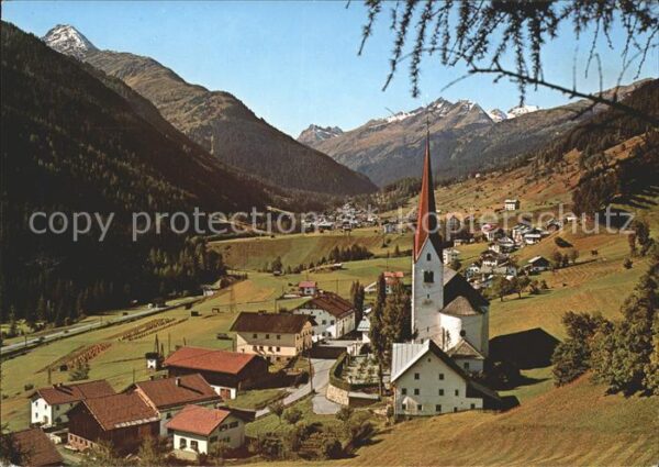 St Jakob Arlberg Ortsansicht mit Kirche und Alpenpanoram