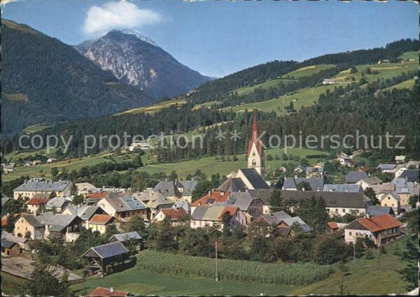 Koetschach-Mauthen Kaernten Ortsansicht mit Kirche Alpenpanorama So