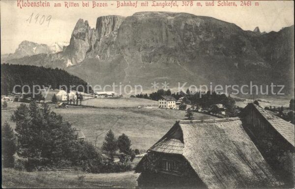 Klobenstein Ritten Bahnhof mit Langkofel und Schlern Dolom