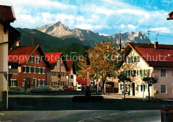 Garmisch-Partenkirchen Floriansbrunnen mit Zugspitzgruppe Wett