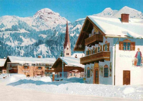 Bayrischzell Ortsmotiv mit Rathaus Kirche Alpen Wint