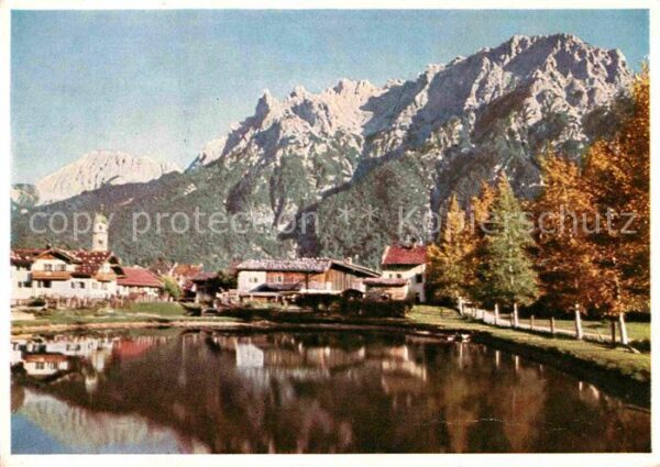 Mittenwald Bayern Ortsansicht mit Kirche Teich Karwendels