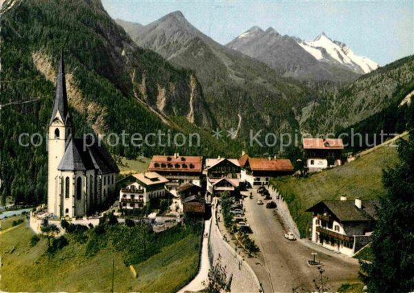 Heiligenblut Kaernten Ortsansicht mit Kirche Blick zum Grossg