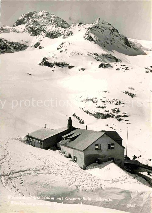Wiesbadener Huette Berghaus mit Piz Buin Winterpanorama Si