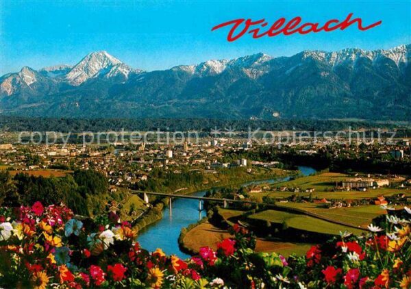 Villach Kaernten Panorama Draustadt mit Mittagskogel Kar