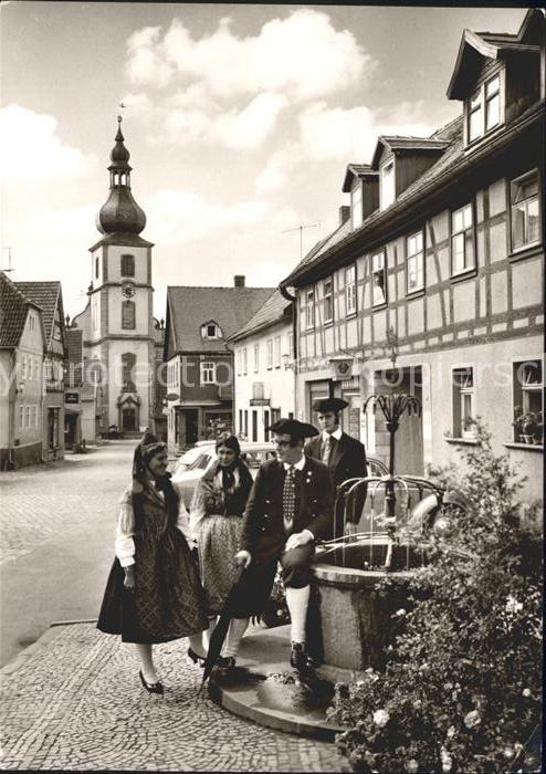 Gersfeld Rhoen Trachtengruppe am Dorfbrunnen Kirche