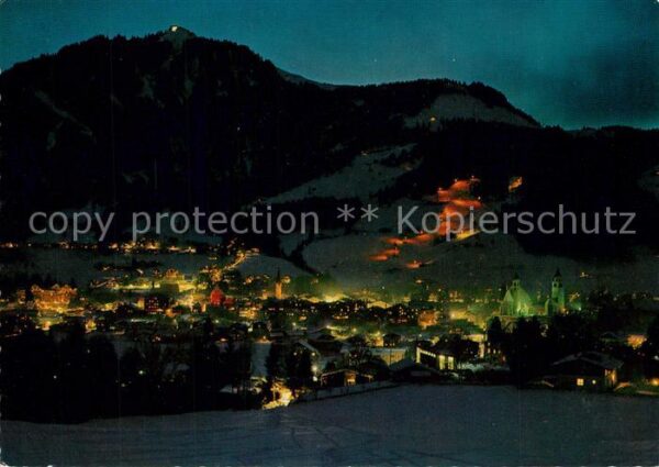 Kitzbuehel Tirol Panorama Nachtpiste gegen Hahnenkamm