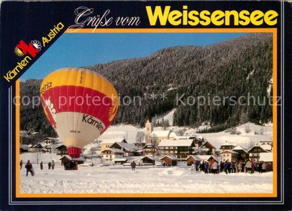 Weissensee Kaernten Winterpanorama mit Heissluftballon