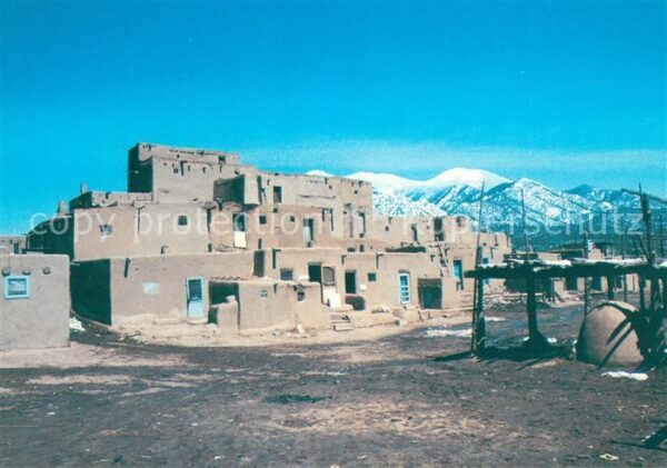 Taos Snow capped mountains behind Taos Puebl