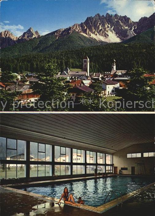 Innichen Suedtirol Ortsansicht mit Kirche Alpen Hallenschw