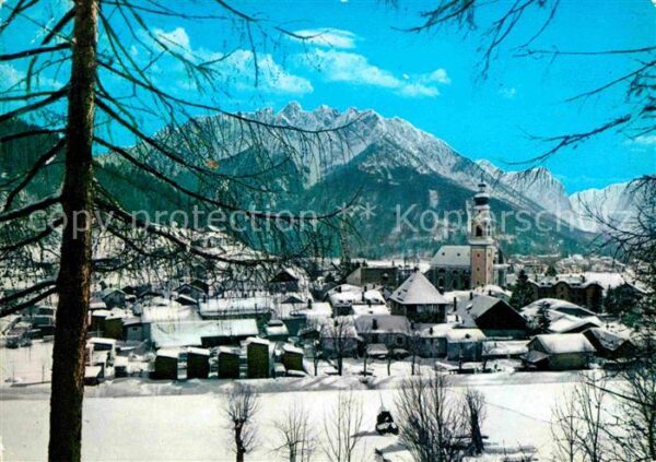 Dobbiaco Pustertal Suedtirol Ortsansicht mit Kirche Winterpanorama A