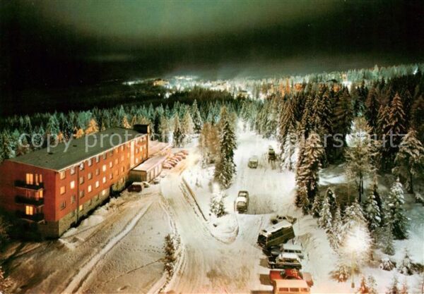 Vysoke Tatry SK Fliegeraufnahme Sporthotel bei Nacht Winter Schnee