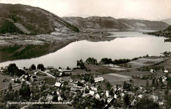 Steindorf Ossiacher See Kaernten AT Fliegeraufnahme mit Julische Alpen