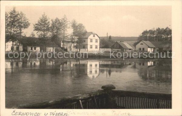 Cernovice Tabora Cernowitz Teilansicht Teich Gebaeude