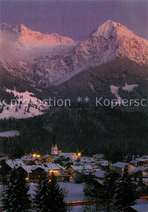 Fischen Allgaeu Wintersportplatz mit Nebelhorn und Rubihorn in der Abendsonne Al