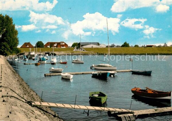 Kollmar Holstein Hafen mit Deich und Faehrhaus