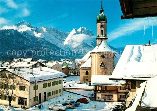 Garmisch-Partenkirchen Ortsmotiv mit Kirche Blick gegen Zugspitzgruppe Wetterste