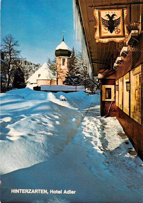 Hinterzarten Hotel Adler mit Kirche Maria in der Zarten im Winter